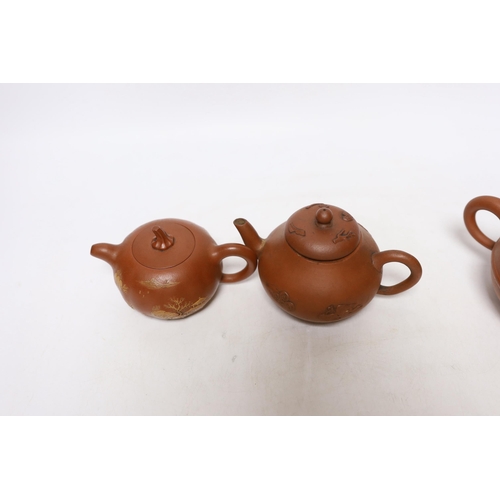 263 - Four Chinese Yixing teapots, one slip decorated with a landscape, tallest 10.5cm Provenance- from a ... 