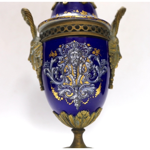 264 - A Limoges style porcelain ormolu mounted urn and cover, 29cm high