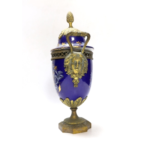 264 - A Limoges style porcelain ormolu mounted urn and cover, 29cm high