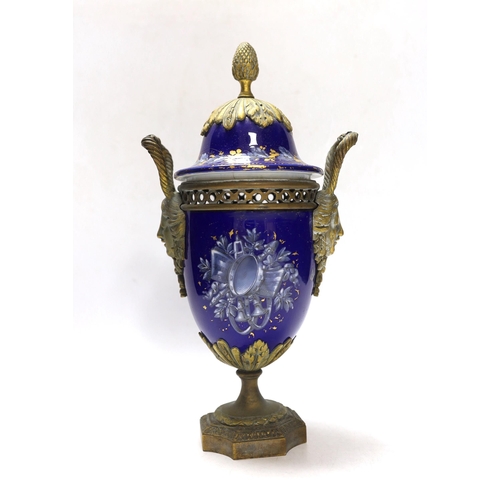 264 - A Limoges style porcelain ormolu mounted urn and cover, 29cm high