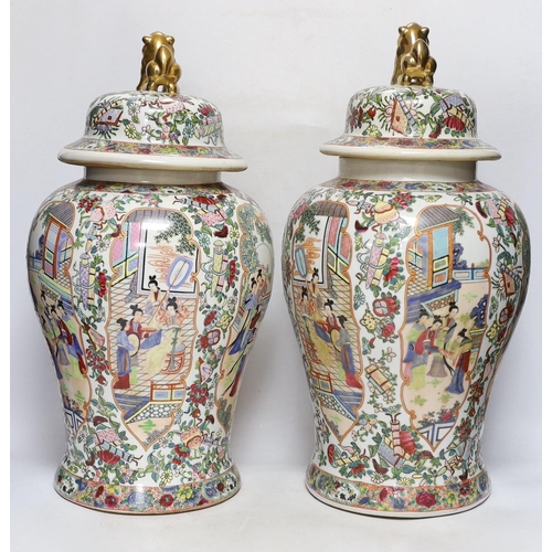 292 - A pair of Chinese famille rose lidded vases, 49cm high