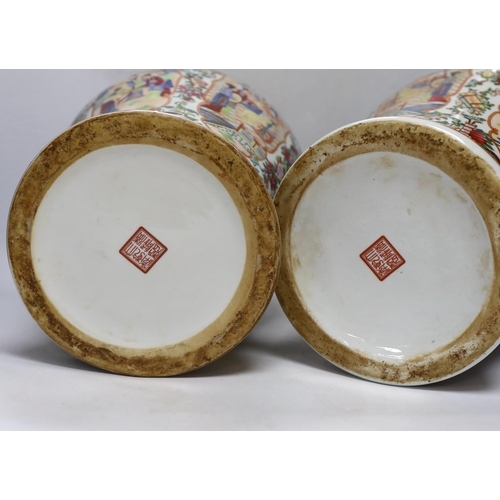 292 - A pair of Chinese famille rose lidded vases, 49cm high