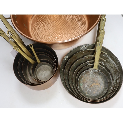 322 - A set of 6 graduated saucepans and a similar and a 2 handled preserve pan, 45cm