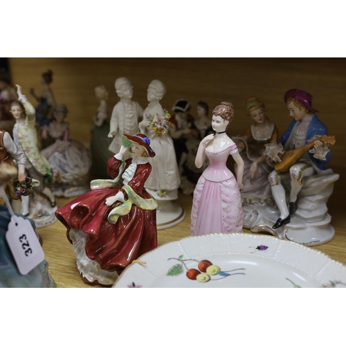 323 - A collection of various porcelain figures including Coalport, Doulton etc. and two dessert plates... 