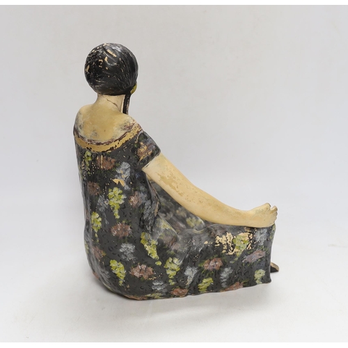 336 - An Austrian painted terracotta figure of a seated girl, 27cm high