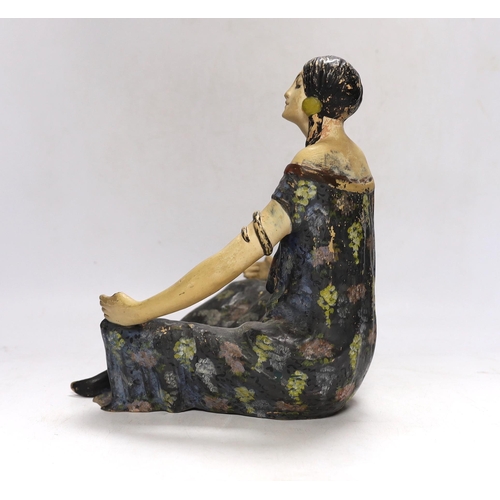 336 - An Austrian painted terracotta figure of a seated girl, 27cm high