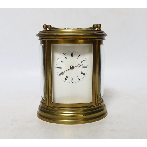 344 - A late 19th century French oval brass cased eight day carriage clock