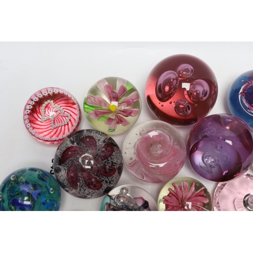 345 - A group of glass paperweights including Caithness