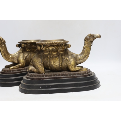 347 - A pair of camel and obelisk side ornaments raised on tapered bases, 51cm high