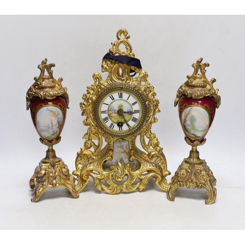 352 - An early 20th century French gilt metal clock garniture, 30cm