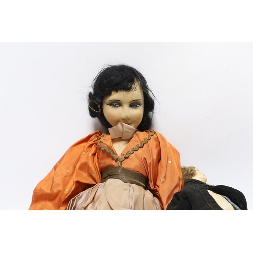 358 - A continental 1920s cloth doll, together with a smaller wax headed doll