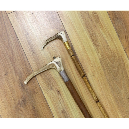 371 - Two riding crops with 15ct gold and silver mounts and horn handles, largest 80cm in length