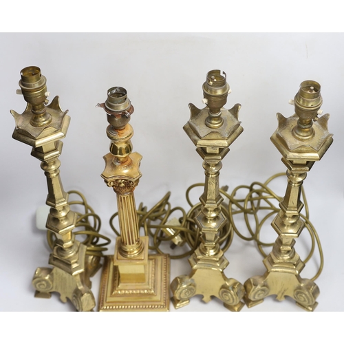 372 - Four brass column lamps including a set of three, largest each 44cm high