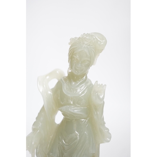 392 - A Chinese celadon jade figure of a lady on wood stand,13cms high.