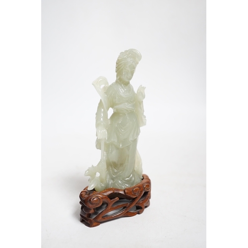 392 - A Chinese celadon jade figure of a lady on wood stand,13cms high.