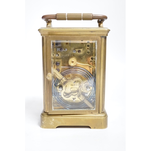 394 - A late 19th century French brass cased eight day carriage clock with incorporated alarm mechanism, r... 