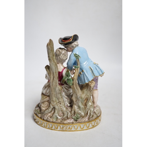 398 - A Meissen group of a boy and a girl with a piccolo, 19th century, the oval base modelled with two tr... 