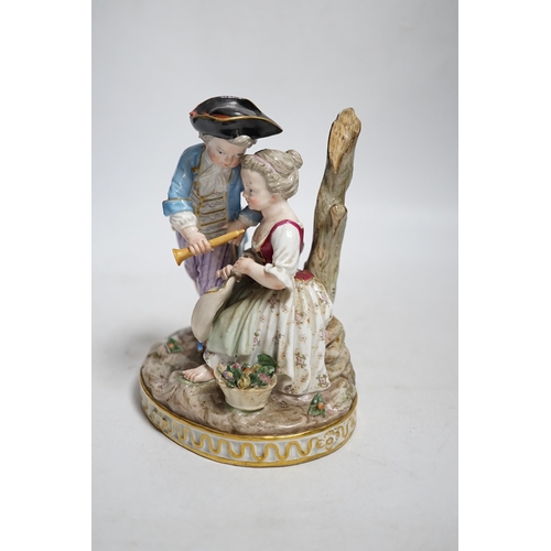 398 - A Meissen group of a boy and a girl with a piccolo, 19th century, the oval base modelled with two tr... 