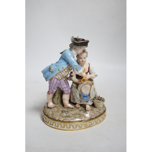 398 - A Meissen group of a boy and a girl with a piccolo, 19th century, the oval base modelled with two tr... 