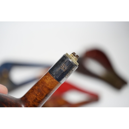 399 - Three cased pipes, one with carved amber novelty bowl, the other two with amber pipe ends, metal mou... 