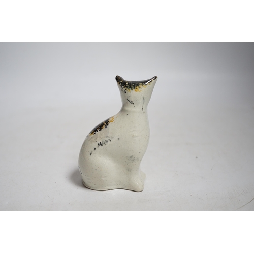 405 - A Staffordshire pottery cat with yellow collar, mid 19th century, height 9.5cm