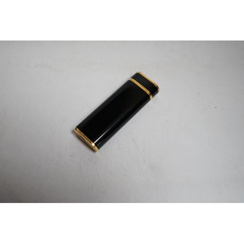 410 - Cartier, black enamel and gold plated lighter