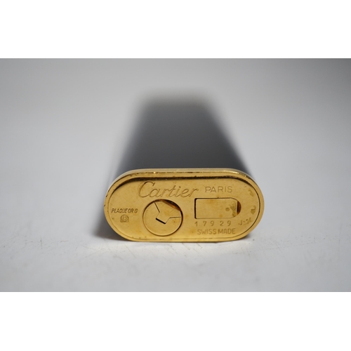 410 - Cartier, black enamel and gold plated lighter