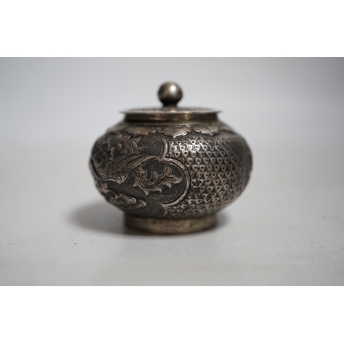 411 - A Chinese white metal unsigned pot and cover,5cms high.