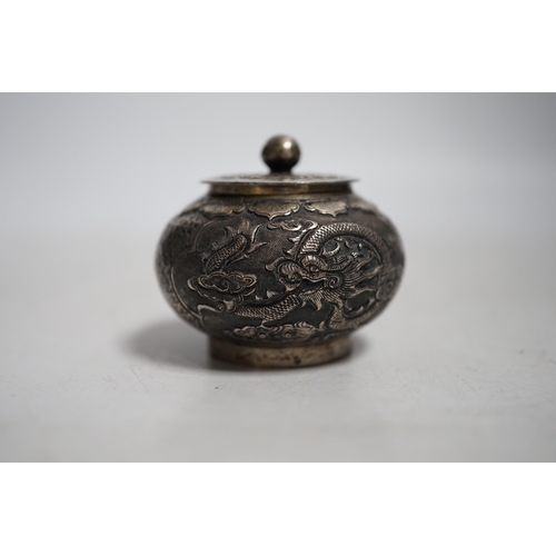 411 - A Chinese white metal unsigned pot and cover,5cms high.