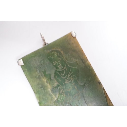 422 - A Chinese carved spinach green jade panel,9cms high.