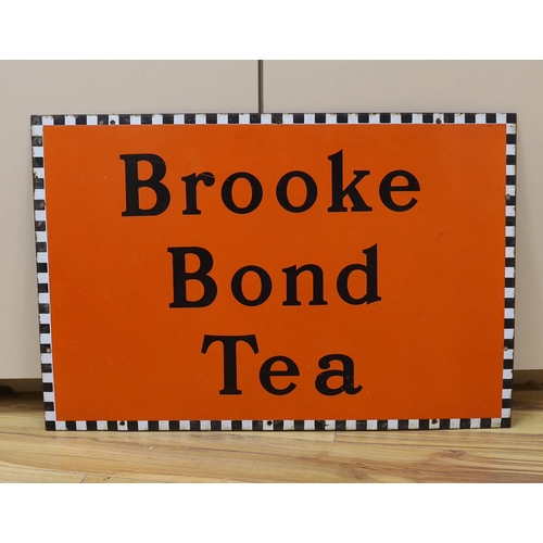 447 - A Brooke Bond Tea enamel sign, 51cm high x 76cm wide