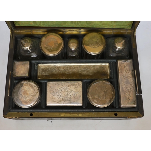 452 - A Victorian vanity case with silver lidded jars, 35cm wide