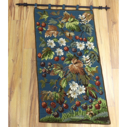 453 - A 20th century woolworked hanging, leaves and flowers, monogrammed and dated