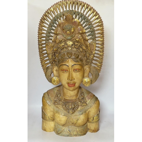 454 - A Balinese carved wood bust of a lady, 69cm