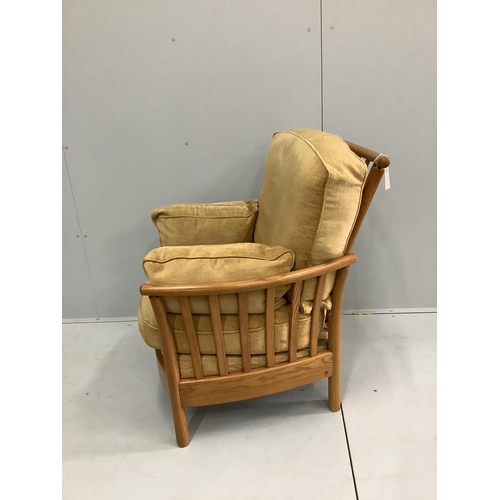 50 - An Ercol oak armchair, width 82cm, depth 68cm, height 93cm