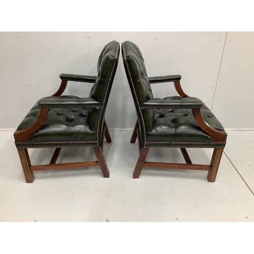 51 - A pair of reproduction Gainsborough style buttoned green leather elbow chairs, width 63cm, depth 54c... 