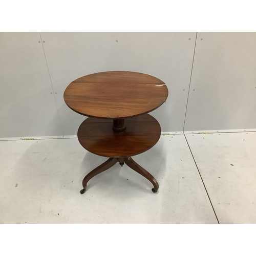 52 - A Regency circular mahogany two tier drop flap occasional table, diameter 63cm, height 76cm