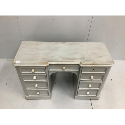 54 - A Victorian pine inverse breakfront kneehole dressing table, cut and later painted, width 122cm, dep... 