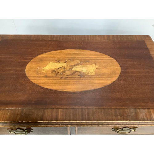 63 - A reproduction George III style banded mahogany chest of drawers, with a later oval marquetry inlaid... 