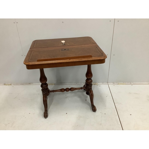 73 - A reproduction Victorian style mahogany reading table with twin hinged flap top, width 70cm, depth 6... 