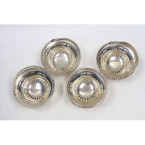 832 - A set of four Edwardian pierced silver circular bonbon baskets, William Neale, Birmingham, 1908, 10c... 