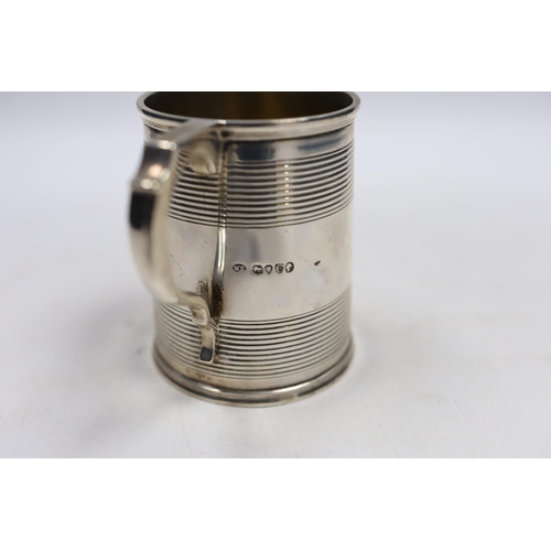 837 - A Victorian reeded silver christening mug, William Evans, London, 1878, 87mm.