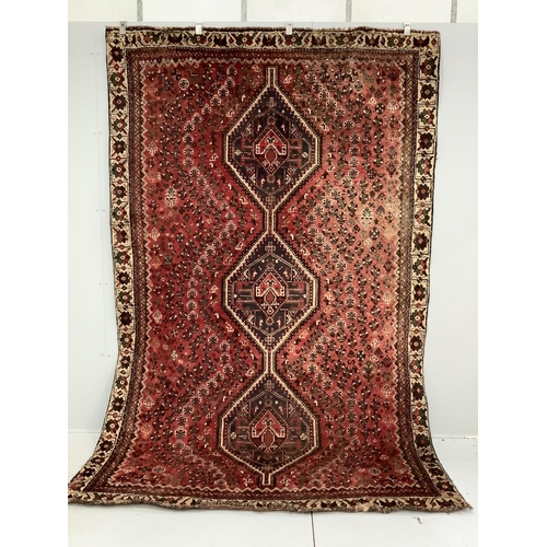 85 - A North West Persian red ground carpet, 290 x 190cm