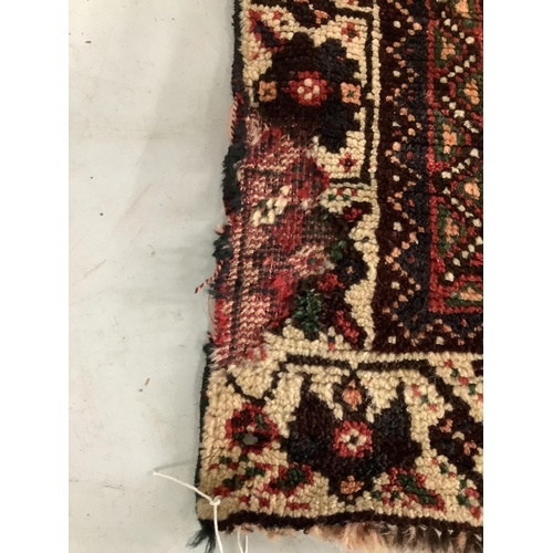 85 - A North West Persian red ground carpet, 290 x 190cm