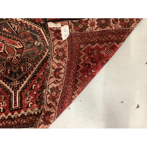 85 - A North West Persian red ground carpet, 290 x 190cm