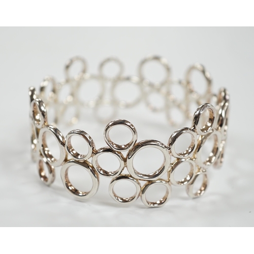 961 - A modern Links of London silver circles bangle, interior diameter 61mm, in Links of London box.... 