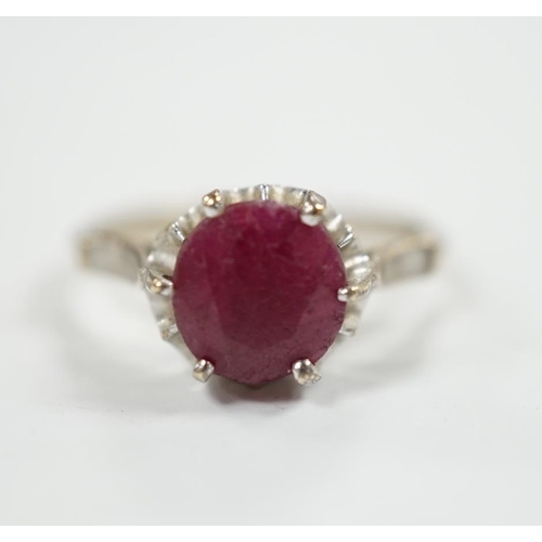 965 - A 750 white metal and solitaire ruby set ring, size M/N, gross weight 3.1 grams.