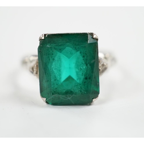 966 - A 14k and single stone green paste set ring, with diamond chip set shoulders, size P, gross weight 3... 