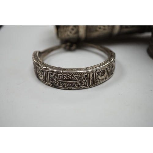 974 - A collection of eight North African Berber white metal jewellery, etc, including bangles, cuffs and ... 