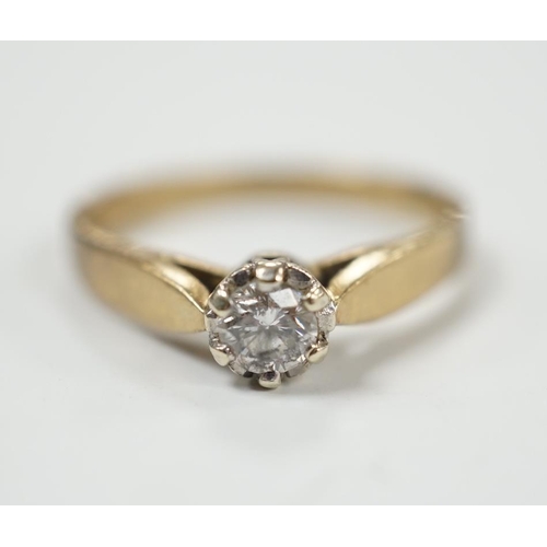 986 - A yellow metal and solitaire diamond set ring, size N/O, gross weight 2.4 grams.